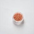 DB-0054 Dark Peach Lined Crystal AB: Läbipaistev helmes virsikusüdamiku ja AB-säraga.